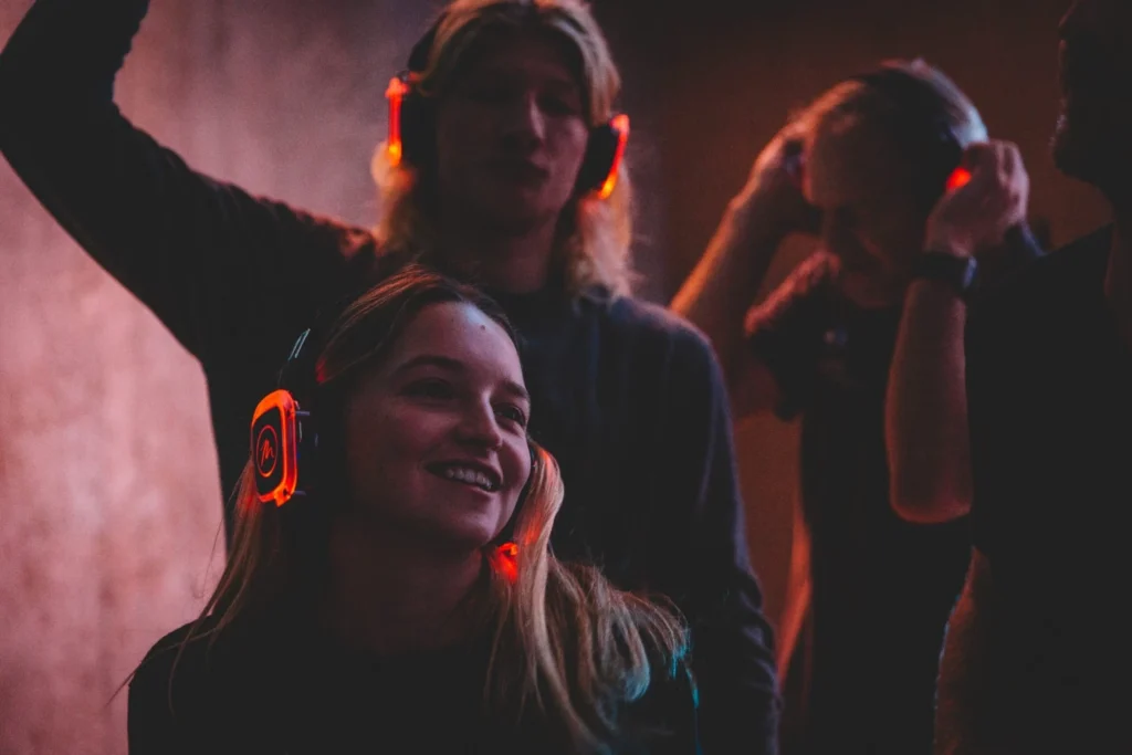 Two friends dancing to silent disco